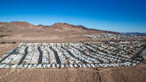 Getty Images Swaths of the US, like this Nevada trailer park, rely on water brought in from miles away