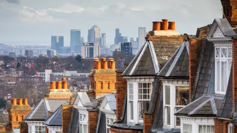 Getty Images Row of housing from north London - overlooking Canary Wharf and city