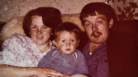 June McMullan June with her husband John Proctor and their son