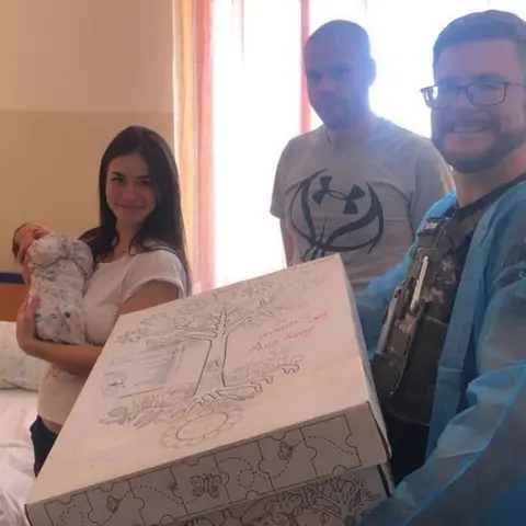 Sunflower Scotland New parents in Ukraine with their baby box