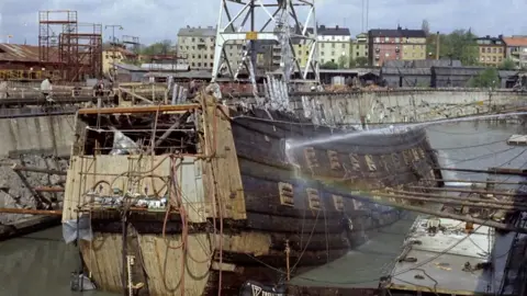 Vasa ship part out of the water in a dock