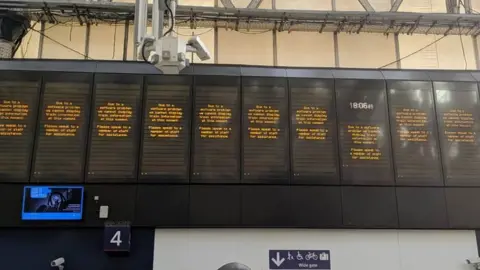 Timothy Choi Boards at Waterloo station.