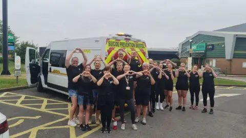 SPB SPB volunteers stand with the charity's van in a car park