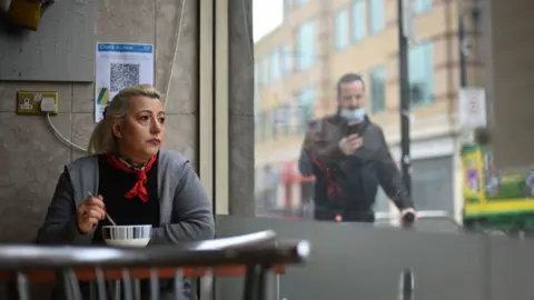 Getty Images Customer in cafe