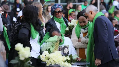 PA London mayor Sadiq Khan and Grenfell survivors