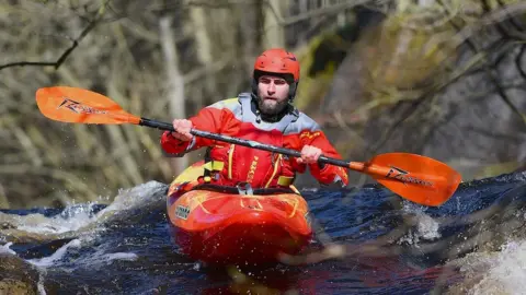 PaddlePeak Kayaker on a river