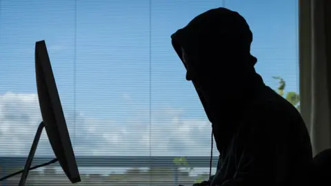 Getty Images Stock image of a person at a computer