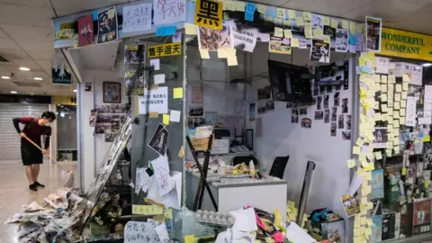 AFP/Getty Images The vandalised office of lawmaker Junius Ho on 22 July 2019