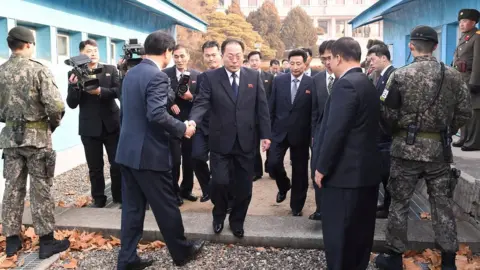 Reuters Head of the North Korean delegation Jon Jong-su, vice chairman of the Committee for the Peaceful Reunification of the Country (CPRC) of the DPRK, crosses the concrete border to attend his meeting with Southern counterparts at the truce village of Panmunjom in the demilitarised zone separating the two Koreas, South Korea, 17 January 2018