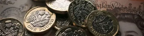 Getty Images piles of notes and coins