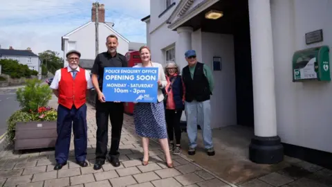 Devon and Cornwall Police Devon and Cornwall Police and Crime Commissioner Alison Hernandez with a police officer and local residents outside Kingsbridge's police station