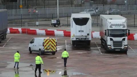 PA Media Lorries at a customs checkpoint at Belfast Port