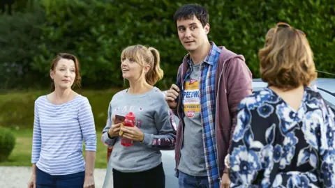 Cathy (left) has the patience of a saint with son Jason and girlfriend Kelly (centre)