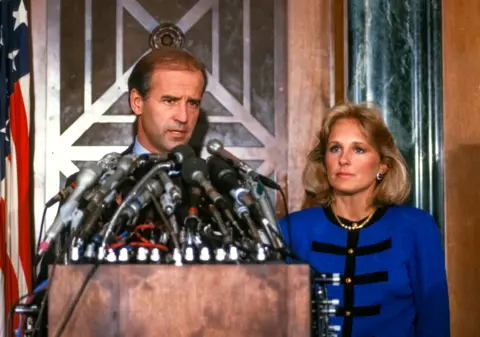 Arnie Sachs / Getty Images US Senator Joseph Biden speaks at a press conference with his wife beside him