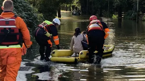 Leicestershire Fire and Rescue Service Family rescued by firefighters from flooded car