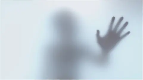 Jacqueline Bourque / EyeEm A hand against glass - posed by model