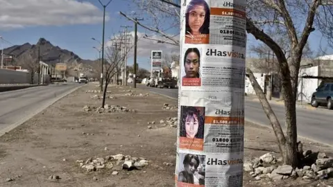 Getty Images Posters with images of missing girls are on a post in a street of Ciudad Juarez, Mexico on February 2, 201