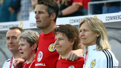 Getty Images Scotland head coach Anna Signeul alongside her staff