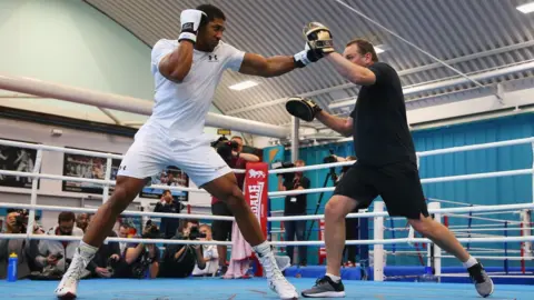Getty Images Anthony Joshua with his trainer Rob McCracken