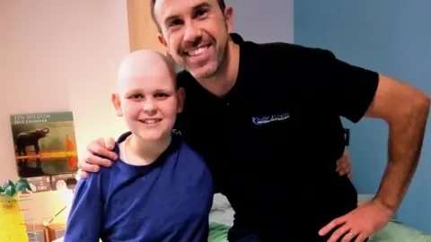 Family handout Alfie with former paralympic triathlete Andy Lewis