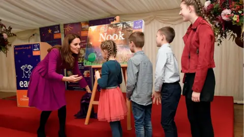 PA Media Four children helped the Duchess of Cambridge unveil a plaque