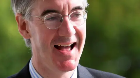 Jacob Rees-Mogg laughing