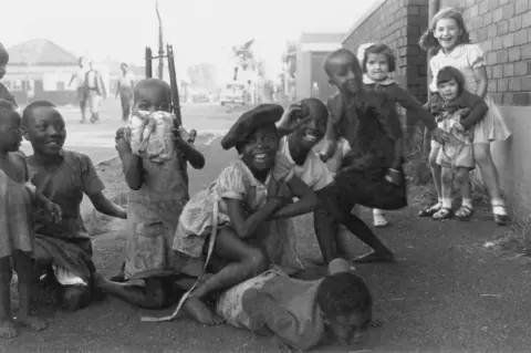 Photograph by David Goldblatt  Children on the border between Fietas and Mayfair, Johannesburg, circa 1959.