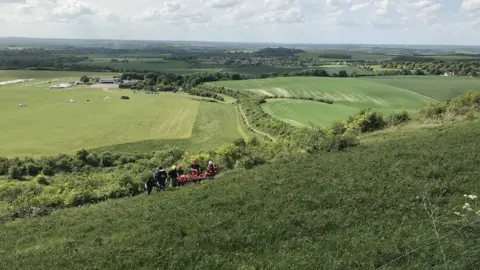 Bedfordshire Fire and Rescue Fire crews rescuing paraglider
