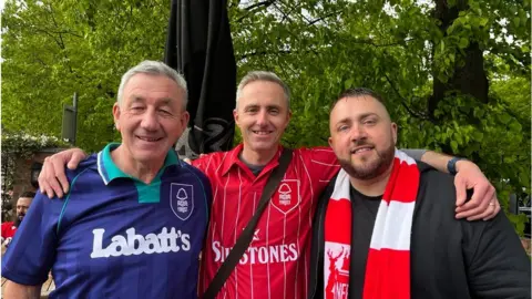 Neil Heath Neil (centre), his dad and a friend