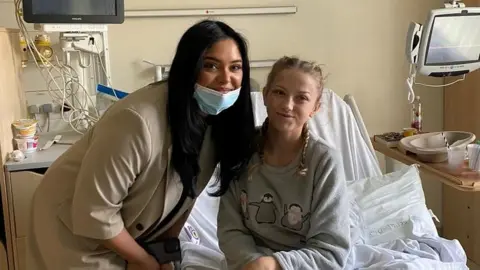 Eid unwrapped Afshan Azad poses with young patient