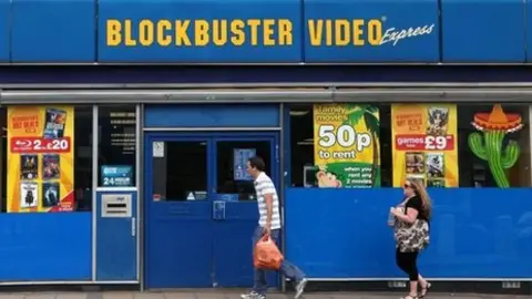 PA Media People walk past Blockbusters store