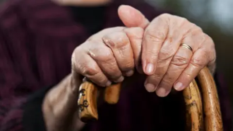 Getty Images Hands of an elderly person