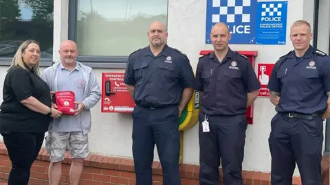 TWFRS Connor Brown's parents hold a bleed kit