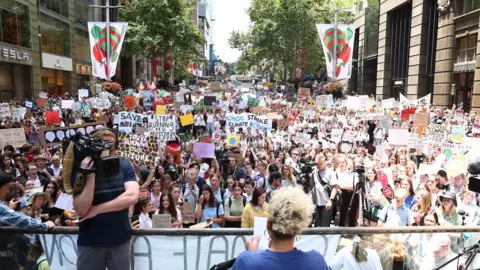 Getty Images A crowd of student protesters fill up a city square in Melbourne