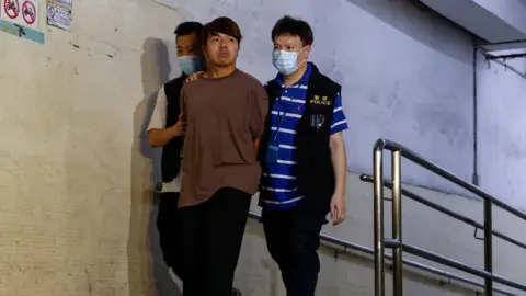 Reuters Political activist Ivan Lam is arrested by police in Hong Kong on suspicion of conspiracy to collude with foreign forces and acts with seditious intent