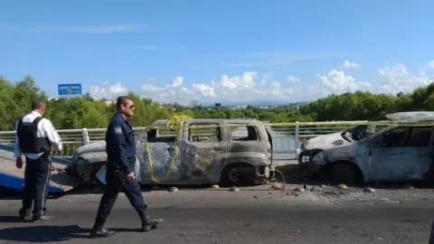 EPA Burned out vehicles in Culiacan, Mexico, after clashes between police and the Sinaloa cartel, 18 October 2019