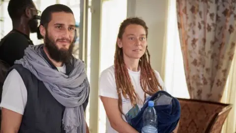 AFP/Getty Images Luca Tacchetto (left) and Édith Blais at Bamako's airport, Mali. Photo: 14 March 2020