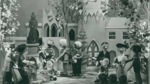 Fenwick Camberwick Green characters in the shop window