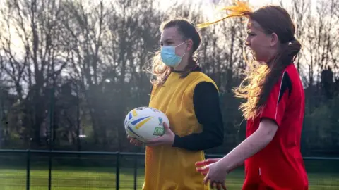 PA Media Children play rugby in Warrington