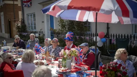 Getty Images Residents in Poundbury, that was built from scratch by King Charles III in accordance with his principles of architecture and urban planning, hosted a street party on Sunday