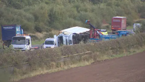 A lorry has overturned on the A1 in high winds