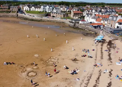 Reuters Cricket match at Elie beach