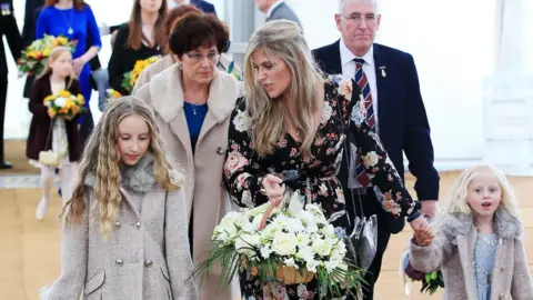 PA The widow and daughters of PC Dave Phillips