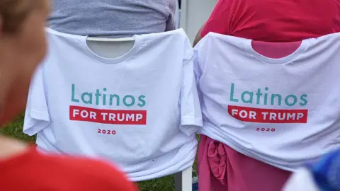 Getty Images Image shows Latinos for Trump t-shirts