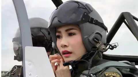 EPA Sineenat Wongvajirapakdi, pictured here piloting a fighter jet, was appointed the king's royal consort in July