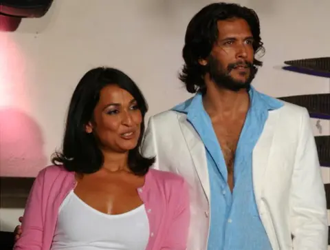 Getty Images Madhu Sapre and Milind Soman share a moment of togetherness after the ramp walk for clothing GANT in Mumbai, Maharashtra, India