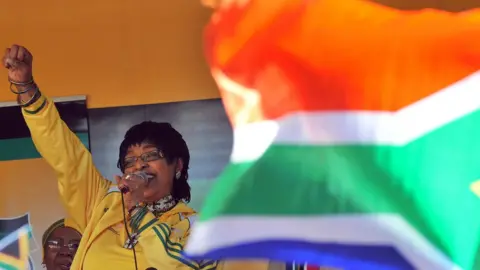 AFP A file photo of Winnie Madikizela-Mandela addressing members of South Africa's ruling party African National Congress (ANC) during a street party on 4 June 2010