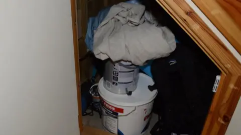 CPS/Hertfordshire Police David Carrick under stairs