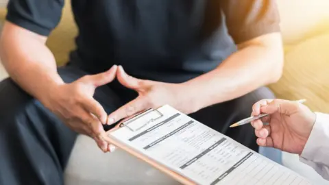Getty Images Man in medical appointment