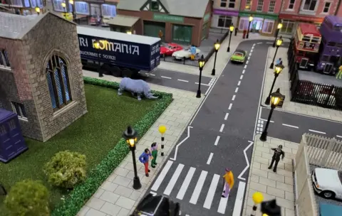 Kevin Jones Another part of Peckham town, featuring a church and a zebra crossing